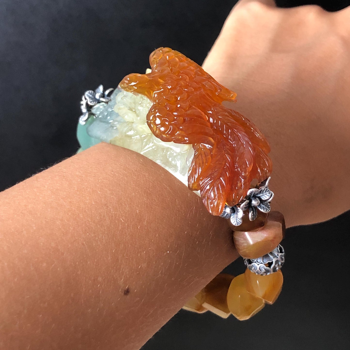 Natural Xiu Jade Serpentine Hand Carved Phoenix & Peony Flower Charm with Irregular Bead Bracelet | Reddish Orange Jade | Vintage Tibetan Silver | Crystal Stone Gemstone Personalized Gift for her Natural Multi-coloured Jade customised bracelet hand engraved jade bracelet carved charm carved pendant phoenix carving peony bracelet yellow jade green jade blue jade red jade silver bracelet tailor made bracelet personalised bracelet diy bracelet untreated jade elastic stretch bracelet