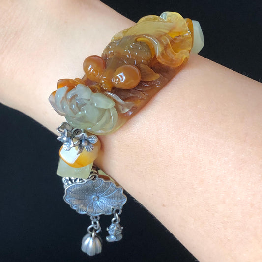 Xiu Jade Serpentine Carved Goldfish Lotus Charm with Irregular Bead Bracelet | Orange Jade | 925 Sterling Silver & Vintage Tibetan Silver accessory hand carved jade carving hand engraved jade bracelet elastic bracelet orange jade bracelet carved goldfish carving engraved lotus carving gift for her duy bracelet natural jade untreated jade dangle bracelet charm bracelet gift for her