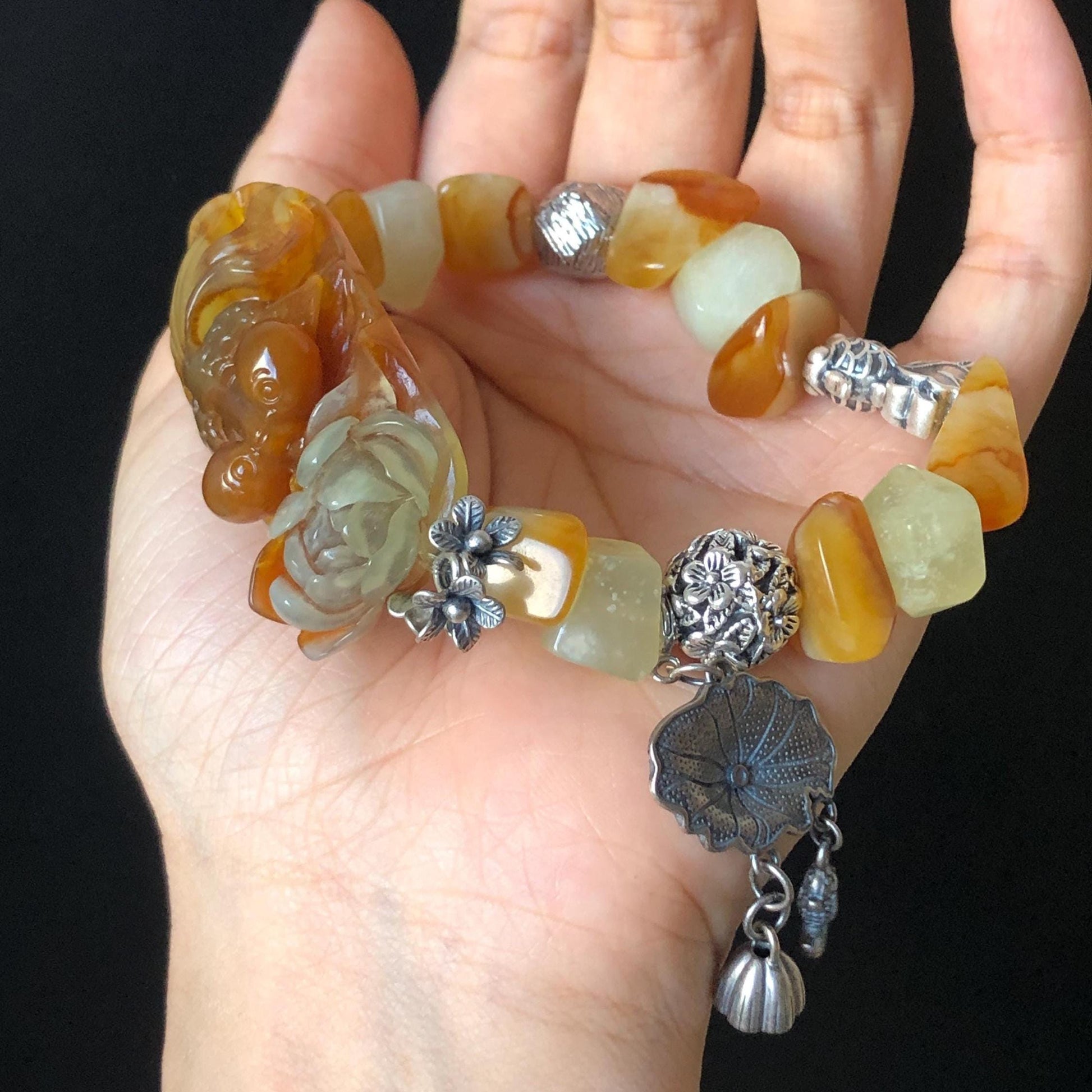 Xiu Jade Serpentine Carved Goldfish Lotus Charm with Irregular Bead Bracelet | Orange Jade | 925 Sterling Silver & Vintage Tibetan Silver accessory hand carved jade carving hand engraved jade bracelet elastic bracelet orange jade bracelet carved goldfish carving engraved lotus carving gift for her duy bracelet natural jade untreated jade dangle bracelet charm bracelet gift for her