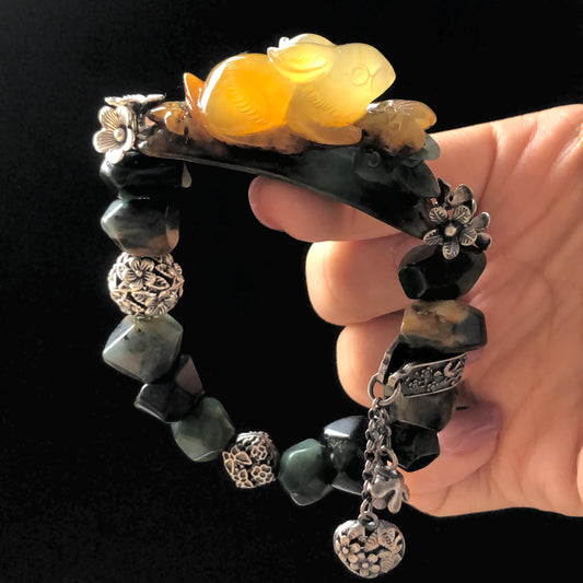 Natural Xiu Jade Serpentine Hand Carved Rabbit Bunny Charm with Irregular Bead Bracelet | Yellow & Deep Green Jade | Vintage Tibetan Silver gift for her rabbit lover gift bunny lover gift customised bracelet hand engraved jade bracelet hand carved bracelet carved charm carved pendant rabbit carving bunny bracelet yellow jade green jade silver bracelet tailor made bracelet personalised bracelet diy bracelet natural untreated jade elastic stretch bracelet