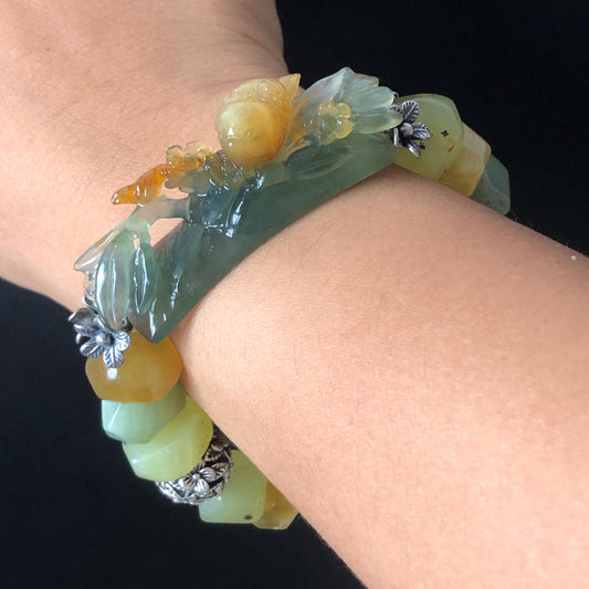Natural Xiu Jade Serpentine Hand Carved Bird Bamboo Flower Charm with Irregular Bead Bracelet | Yellow & Green Jade | Vintage Tibetan Silver Accessory | Handcrafted Crystal Stone Gemstone Gift for her bracelet jade carving hand engraved green jade yellow jade hand engraved jade bracelet hand carved jade charm engraved jade pendant irregular bead bracelet elastic stretch bracelet silver accessory vintage bracelet antique bracelet bird carving bamboo carving flower carving personalized bracelet