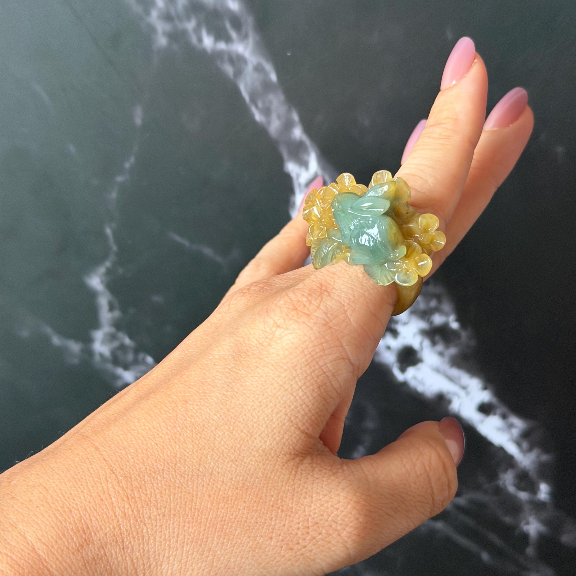 Xiu Jade (Serpentine) Hand Carved Rabbit & Flower Statement Ring 17.7mm (US 7-7.25): Natural Green Yellow Jade 3D stone carving Statement Ring Band Ring gift for her green jade carving yellow jade bi colour jade rabbit carving hand engraved statement ring flower carving hand carved flower natural untreated jade handcrafted jade ring 3D carving Stone carving Gemstone Carving rabbit Lover gift jade cocktail ring jade band ring bunny ring bunny carving